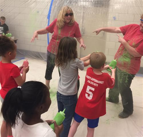 Students spraying paint on teachers 