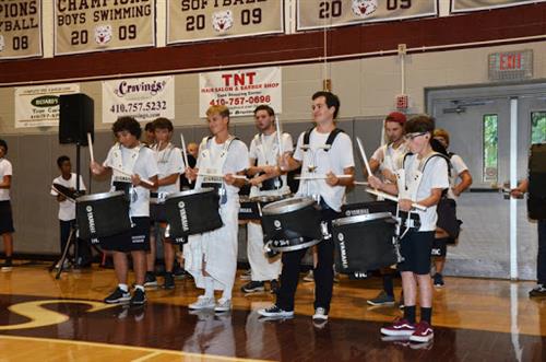 Marching band playing in gym 