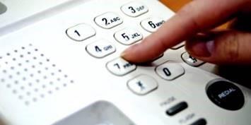finger dialing on landline phone 
