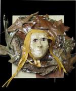 White mask in a bed of brown leaves and a black border