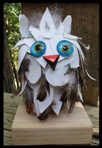 mixed media sculpture of a white owl