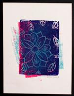 Layered red and blue prints of a flower