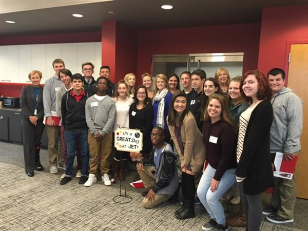 Students at iJET posing in front of sign, "It's a great day at iJET!" 