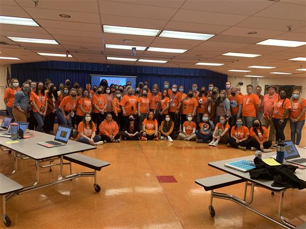 OMMS Staff dressed in orange to show unity
